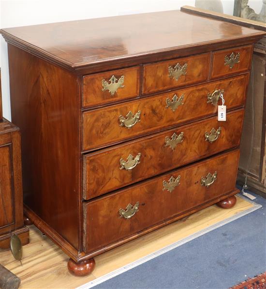 An 18th century burr walnut chest of drawers on bun feet (restored) W.102cm